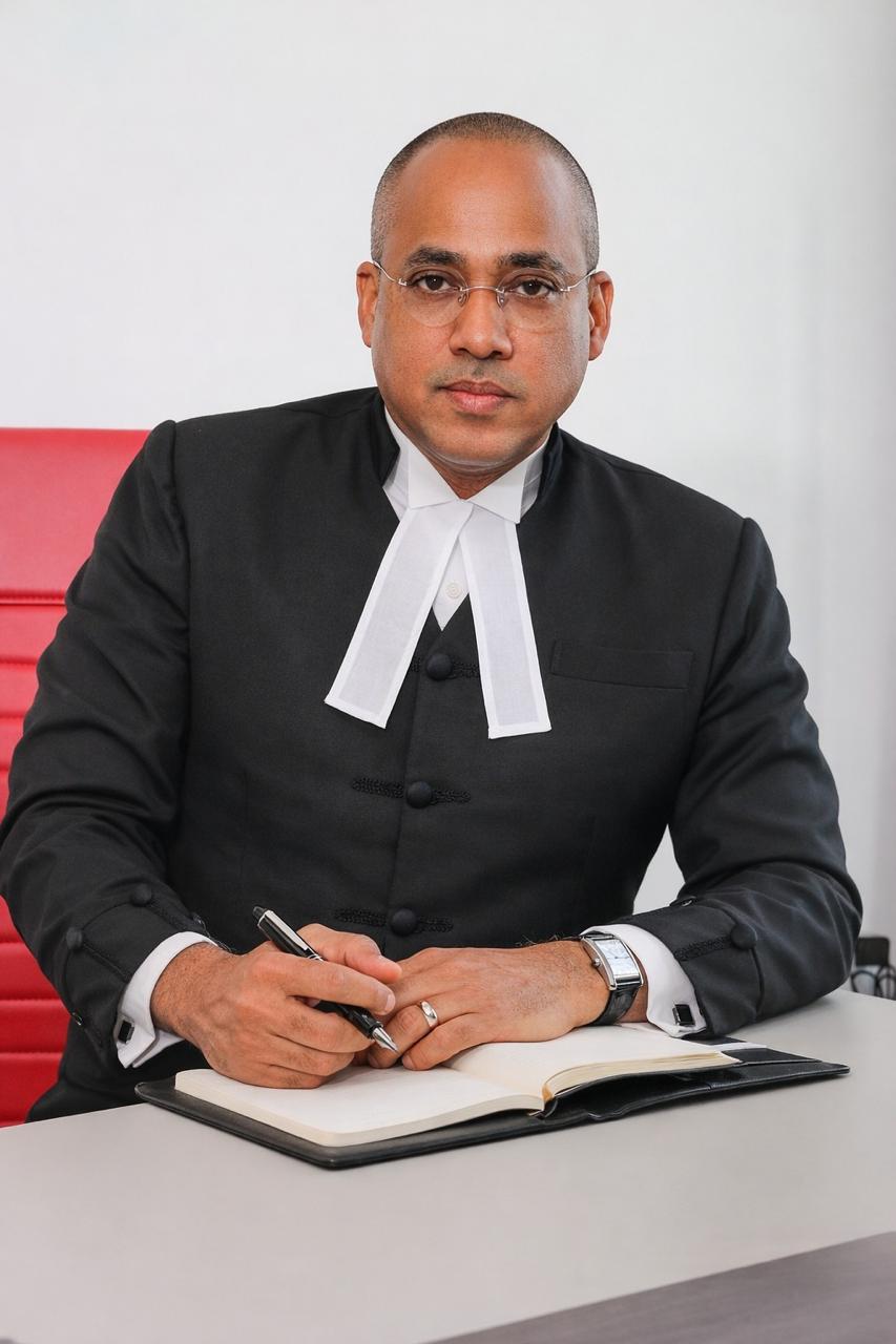 Mr. Peter C. Champagnie, K.C., J.P.